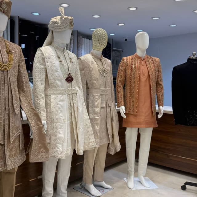 Earthy tones, including beige, cream, and terracotta with gold accents Sherwani, Kurta, and Jacket ensembles