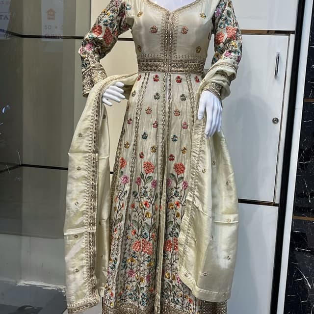 Ivory, with multicolored floral embroidery and gold accents Anarkali Suit with Dupatta