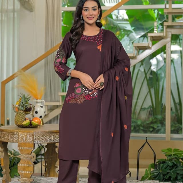 Brown, with accents of red, pink, orange, green, and white in the embroidery. Salwar Kameez with Dupatta