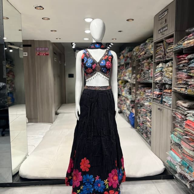 Black, with a vibrant mix of blue, pink, red, and green on the top and skirt's hem Lehenga Choli