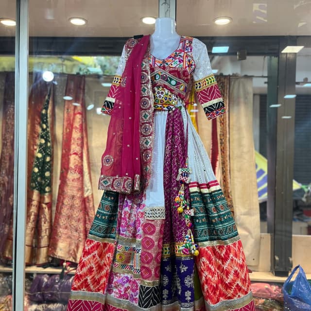 Multicolor, featuring white, red, green, purple, and gold accents. Lehenga Choli