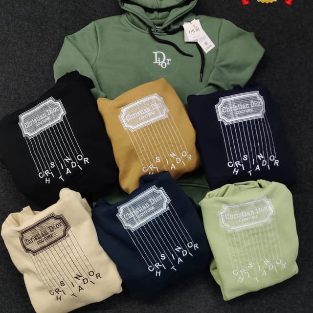 Various, including black, mustard yellow, navy blue, beige, and olive green. The primary color of each hoodie is contrasted with white embroidery. Hoodie