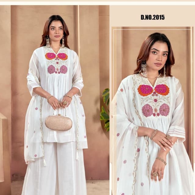 White with accents of orange, pink and gold. Kurta with palazzo pants