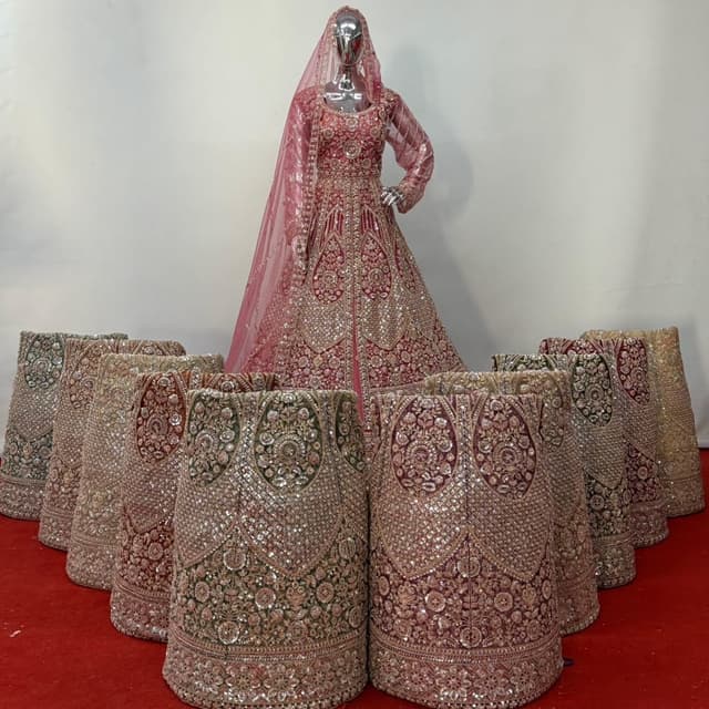 Various shades of red, green, and gold with silver accents. Lehenga Choli with Veil