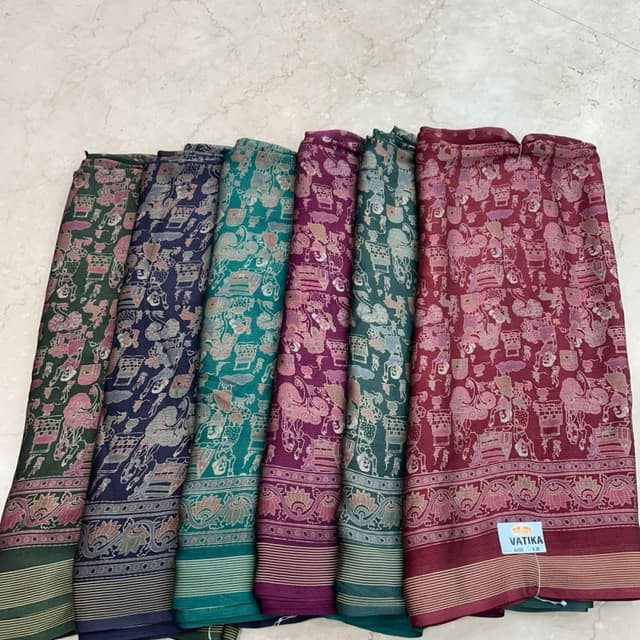 Various, including shades of green, blue, purple, and maroon, with contrasting border colors. Saree