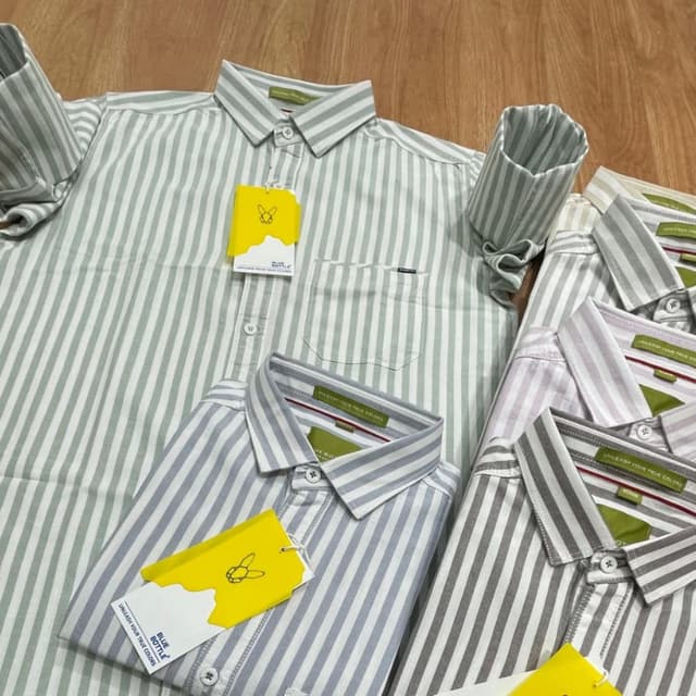 Various pastel colors with white stripes (e.g., light green, blue, gray, and mauve) Shirt