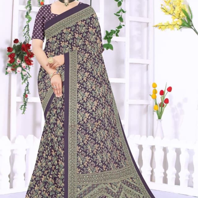 Purple, green, beige, and touches of pink. Saree