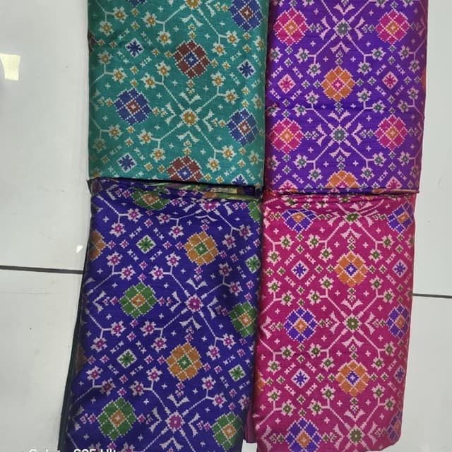 Teal, Purple, Pink, Blue with geometric patterns in multiple colors Fabric/Textile
