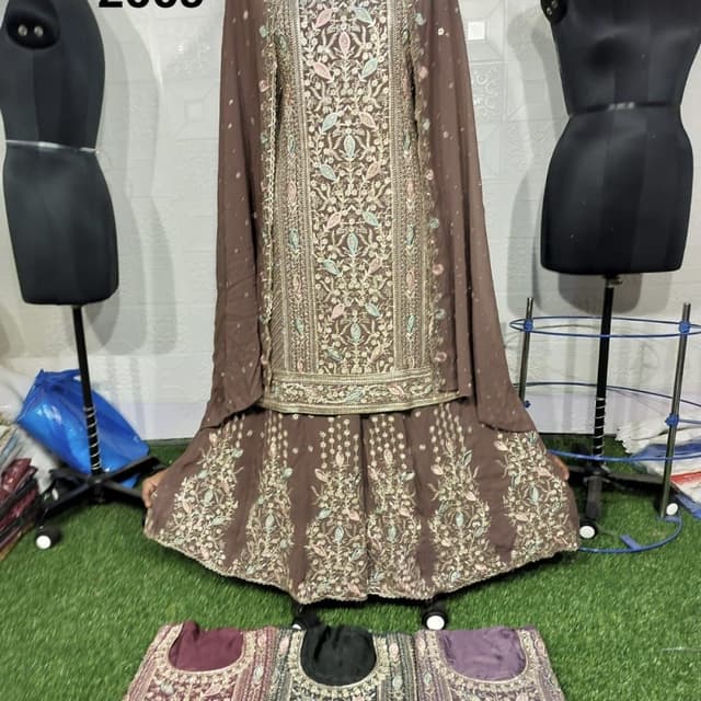 Brown, with embroidery in pastel shades of pink, blue, and gold Sharara Suit