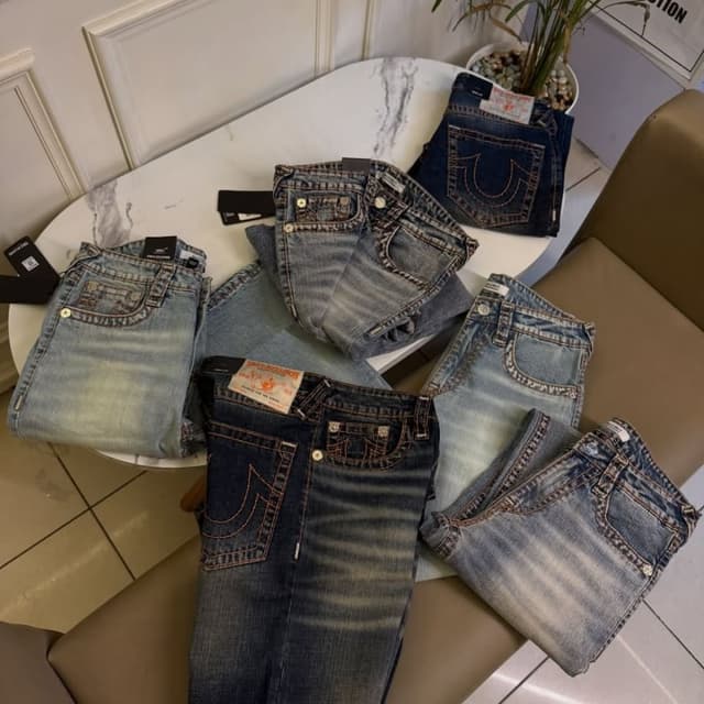 Various shades of blue, including light wash, medium wash, and dark wash with copper-colored stitching. Jeans