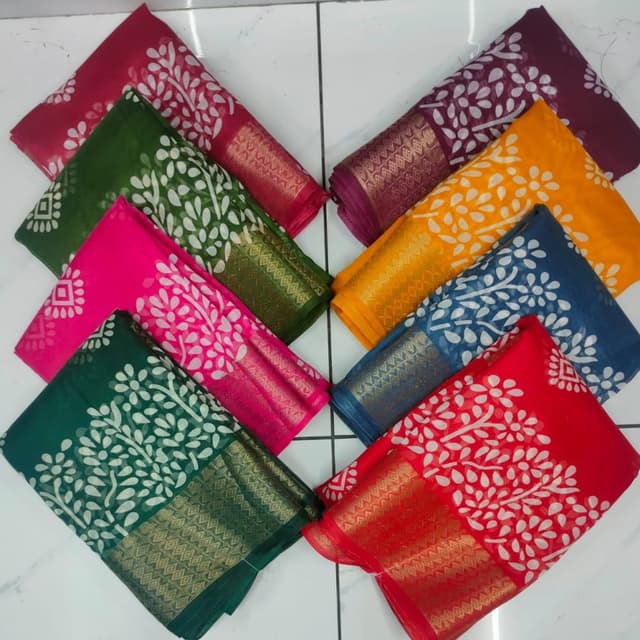 Various vibrant colors including red, green, pink, yellow, blue, and purple with white and gold accents. Sarees