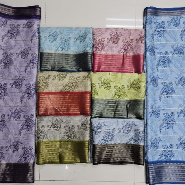 Various pastel colors including lavender, blue, pink, green, and neutral tones, with contrasting border colors like black, red, and gold. Saree