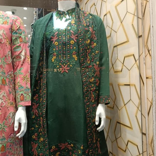 Emerald Green with floral embroidery in shades of red, yellow, and orange Kurta with long jacket