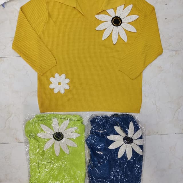 Yellow with white and black accents, and hints of green and blue Sweater
