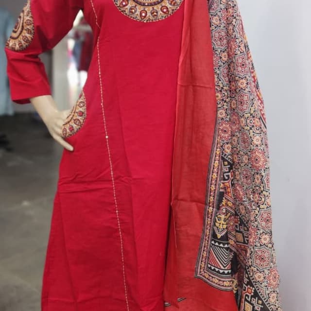 Red, with multi-colored accents on the embroidery and printed dupatta Salwar Kameez