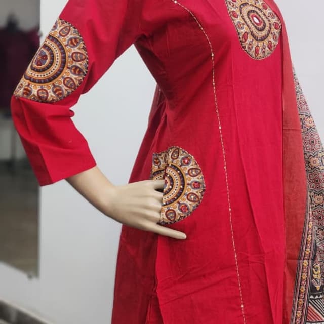 Red, with accents of gold, brown, blue, and white. Kurti with Dupatta