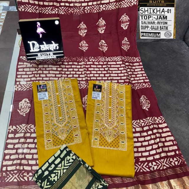 Mustard yellow, maroon, and green with white accents Salwar Kameez Suit