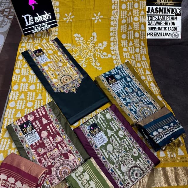 Various - includes shades of green, maroon, teal, and gold, with a yellow and white base fabric. Salwar Kameez Suit