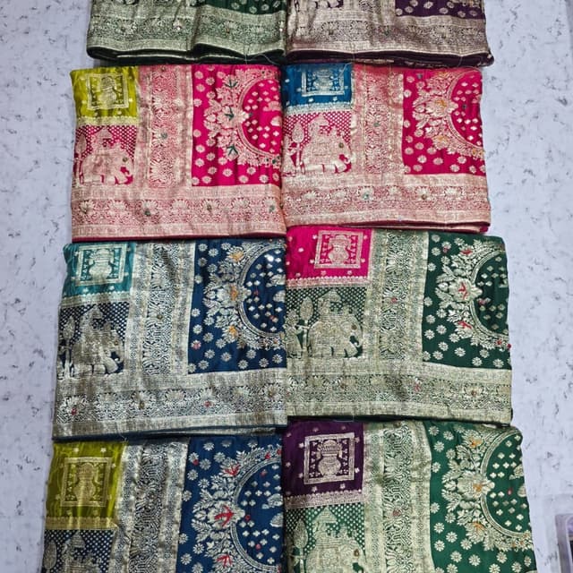 Various, including shades of pink, blue, green, and purple with gold accents. Saree