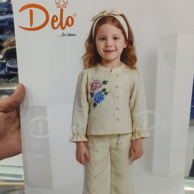 Off-white, with pink, blue, and green floral accents Pajama set