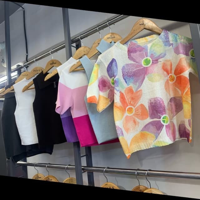 Multicolor, featuring shades of orange, purple, green, yellow, and blue on a white base. T-shirt