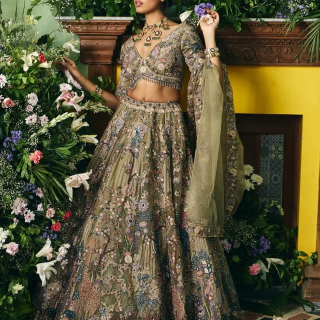 Olive green, with accents of blue, purple, pink, and gold Lehenga Choli