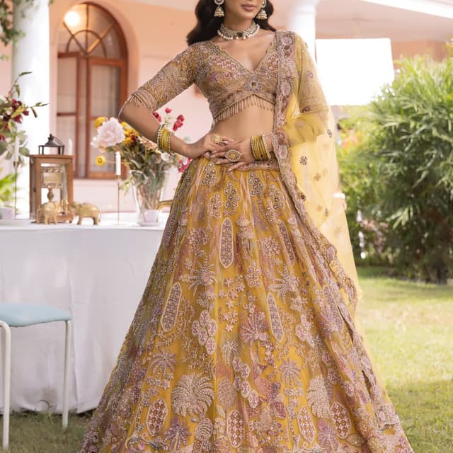 Mustard yellow, with accents of rose pink, and gold Lehenga Choli