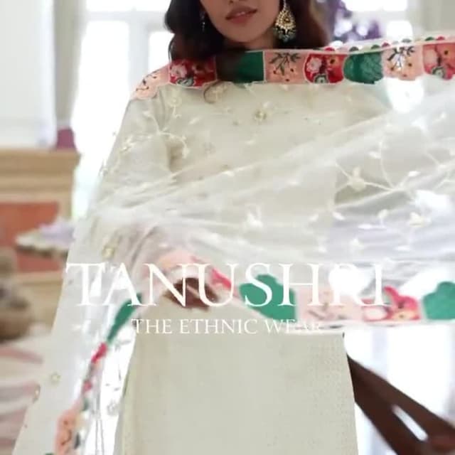 Ivory, with accents of green, pink, red, and floral patterns on the dupatta border Salwar Kameez