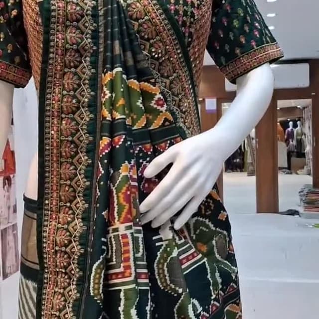 Green, gold, orange, and red Saree