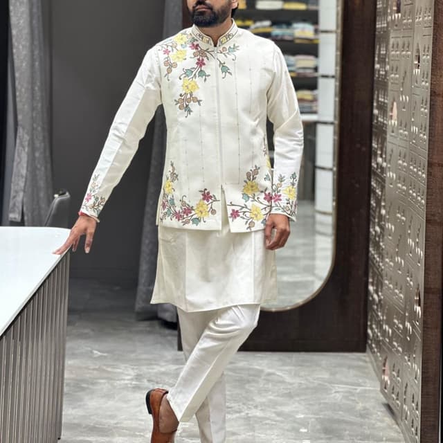 Ivory white, with floral embroidery in yellow, pink, and green Kurta Pajama set with a waistcoat