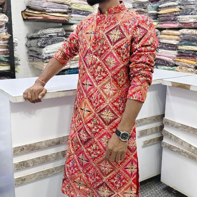 Red, orange, gold, and hints of pink and green. Kurta