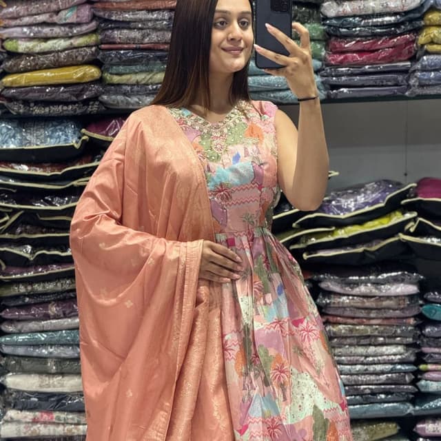 Peach, pink, green, blue, and gold accents. Anarkali Suit with Dupatta