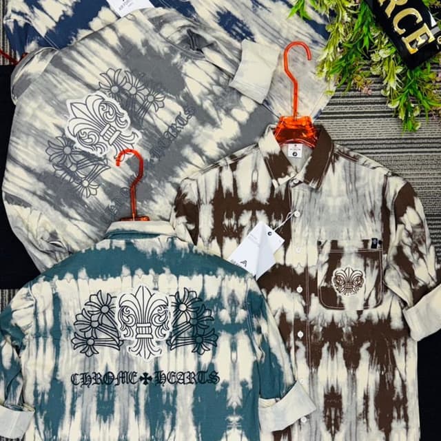 Various shades of blue, gray, and brown combined with white in a tie-dye effect. Shirt