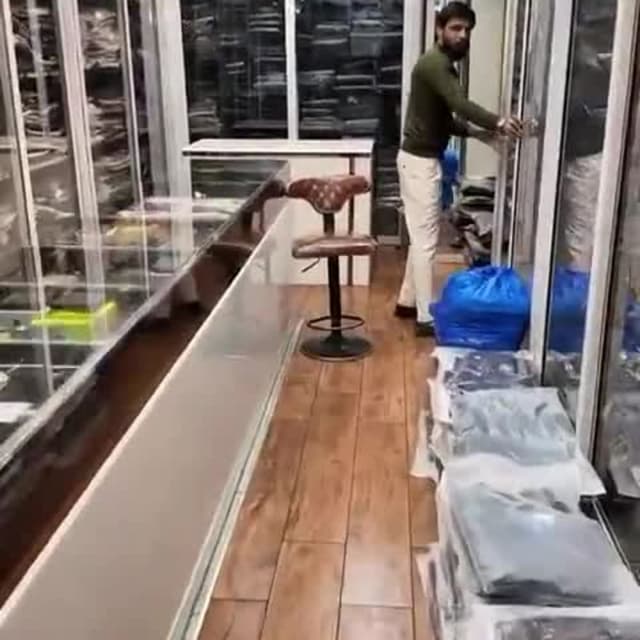 Various, likely including blues, blacks, and whites, based on visible items Clothing items, likely shirts, pants, and other garments