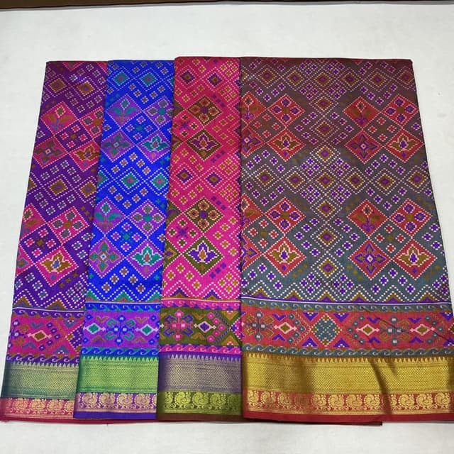 Vibrant and varied, including blue, pink, purple, green, gold, and red, creating a rich and intricate display. Saree