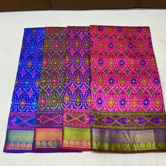 Vibrant shades of pink, purple, green, gold, and blue Saree