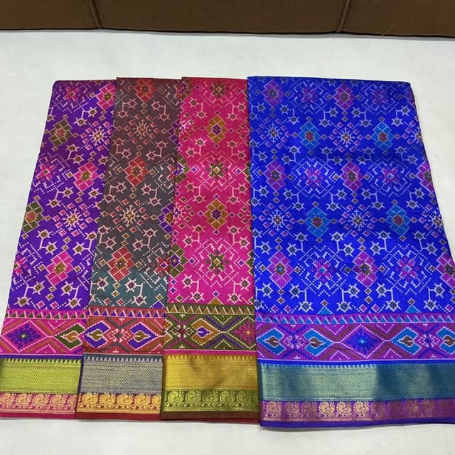 Various, including shades of pink, blue, brown, green, gold, and purple Saree
