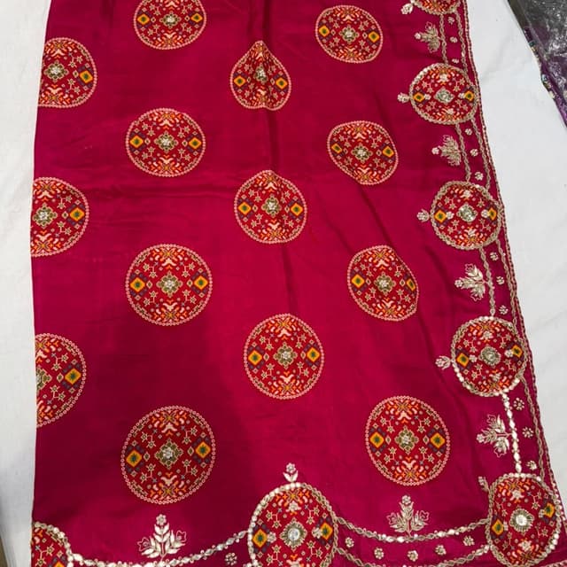Magenta, with accents of gold, yellow, green, and silver Saree