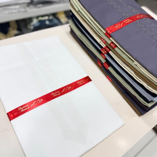 White, with various other colors visible Thobe/Dishdasha/Kandura