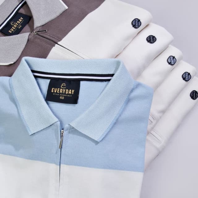 Blue and White, with a hint of gray in one shirt Polo Shirt