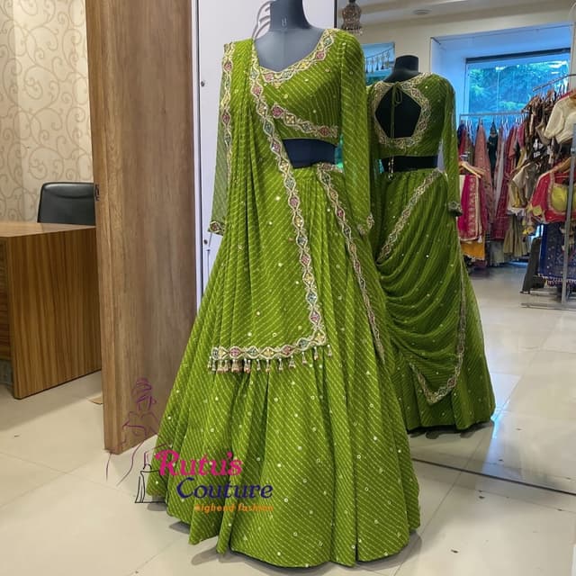 Green, with hints of multicolor embellishments Lehenga Choli