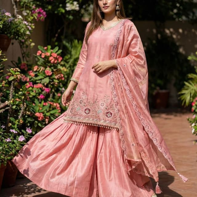 Peach, with hints of gold and pastel shades in the embroidery Sharara Suit