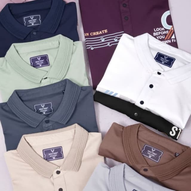 Various solid colors including mauve, navy, mint green, charcoal grey, beige, brown, and light blue. One shirt has a dark burgundy base with white accents. Polo Shirts