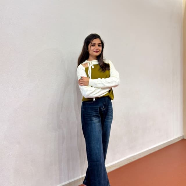 White, Olive Green, and Dark Blue Sweater and Jeans