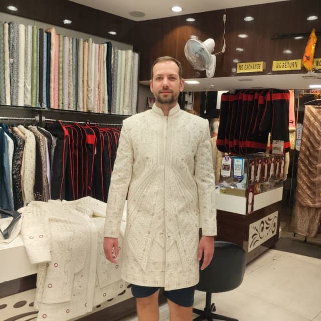 Ivory and subtle hints of red Jacket/Sherwani