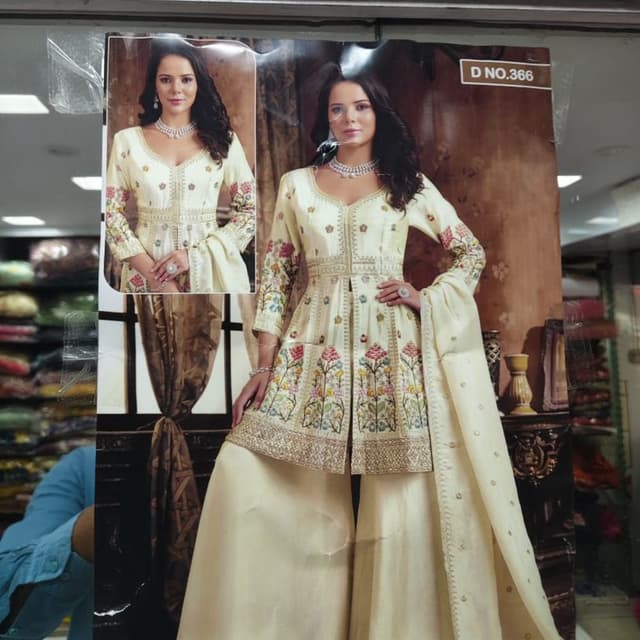 Ivory, with accents of pink, green, and yellow Sharara Suit