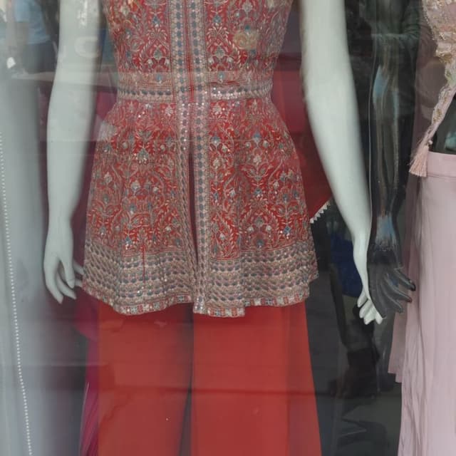 Red, with accents of blue, silver and beige Peplum Top and Palazzo Pants Set