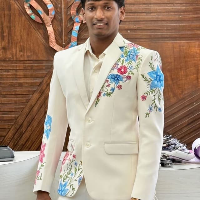 Off-white with floral accents of blue, pink, green, and red Suit