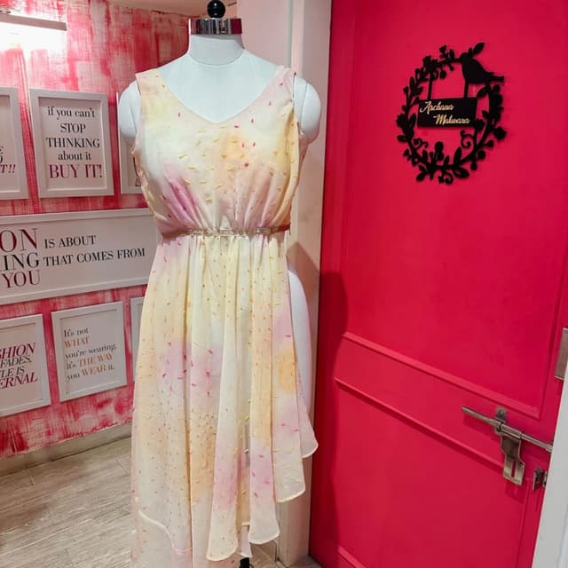 Soft pastel shades including yellow, pink, and white Dress