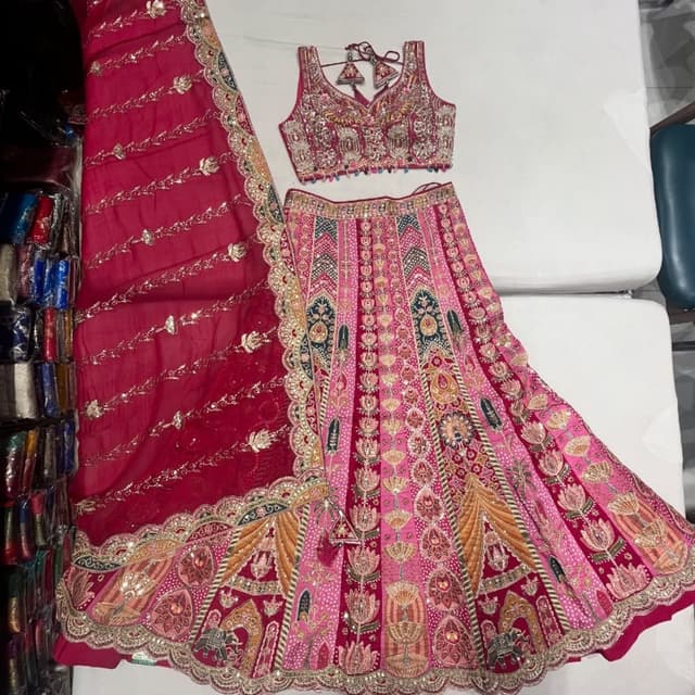 Pink, red, gold, green, and orange Lehenga Choli